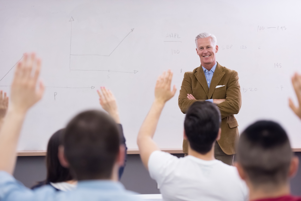 Professor in front of whiteboard