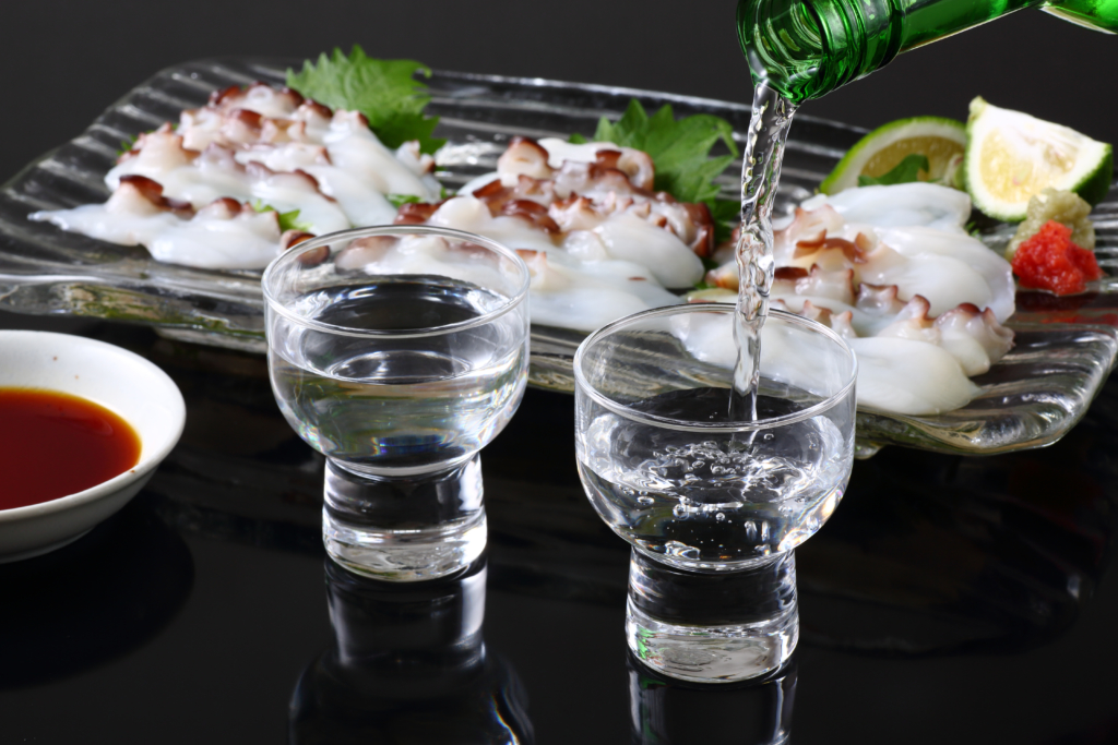 pouring sake into glass
